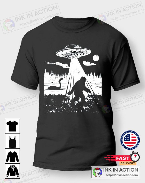 https://images.inkinaction.com/wp-content/uploads/2022/10/Bigfoot-Real-Sasquatch-Funny-Bigfoot-Hiking-Yeti-Loch-Ness-Monster-Ufo-Alien-Tshirt-4-600x757.jpg