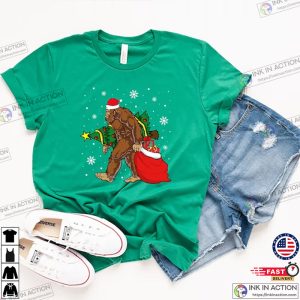 Bigfoot Carrying Christmas Shirt Christmas Shirt Happy Shirt Trend Shirt Big Foot Hunter Shirt Animal Lover Gift 1
