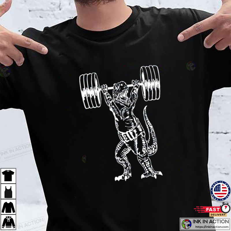 https://images.inkinaction.com/wp-content/uploads/2022/12/Dinosaur-Weight-Lifting-Barbell-Men-T-Shirt-Boyfriend-Gift-Fitness-Tee-Gym-Shirt-Workout-T-Shirt-2.jpg