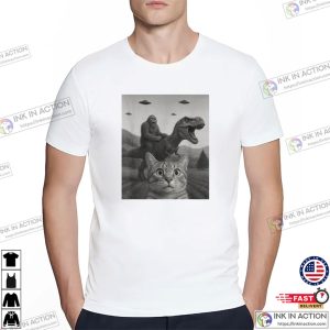 Funny Cat Selfie With Bigfoot Riding T-rex Dinosaur T-shirt